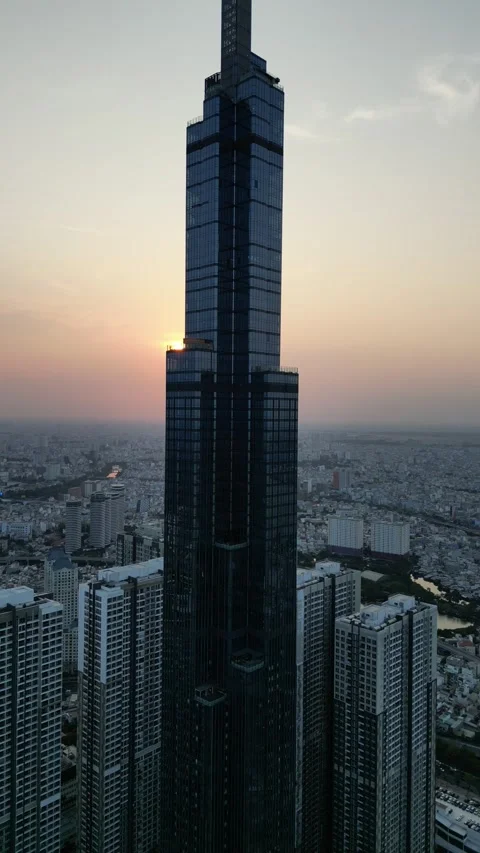 Drone Flying Around Modern Skyscraper in Ho Chi Minh City, Vietnam Stock Footage 335602044