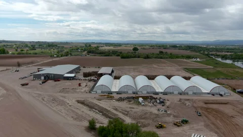 Drone flying around a produce processing plant in Parma Idaho April 2024. Stock-Footage 276707687