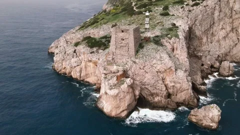 Drone flying around Punta Campanella lighthouse, Sorrento Coast. 4K Stock Footage 304668673