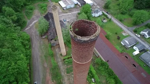 Drone flying around then down coal stacks Stock Footage 70602743