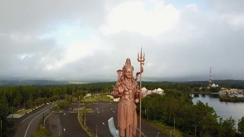 Drone flying around a very big shiva statue in ganga talao. tourist Stock Footage 104855308