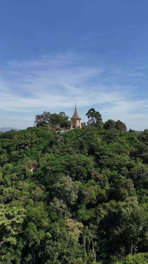 Drone Flying Away from Buddhist Temple on a Green Mountain Top in Pattaya, Stock Footage 335840424