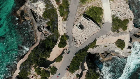 Drone flying away cliff beach. Beautiful coastline with waves. Bird view Stock Footage 169980240