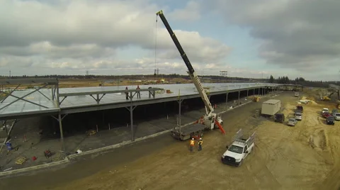 Drone flying away from crane Stock Footage 63936158