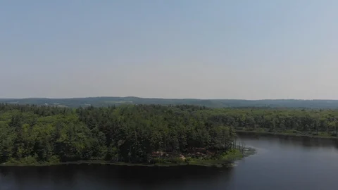 Drone Flying Away from Forest and Pond and Rising Up Vídeo Stock 92178242