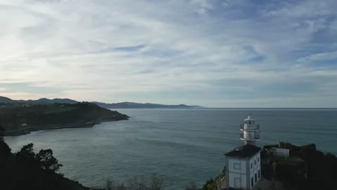 Drone flying away from Getaria Lighthouse in Basque Country 스톡 동영상 334246354