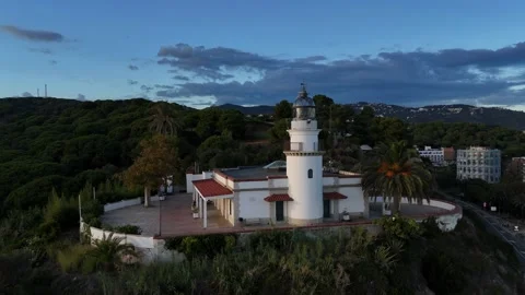 Drone Flying Away From Lighthouse at Sunset, Costa Brava, Spain Stock Footage 319861108