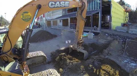 Drone flying away from mechanical crane on construction site Stock Footage 63941214