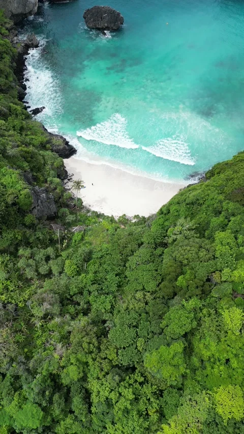 Drone Flying Away from a Secluded Beach in Koh Phi Phi, Thailand Stock Footage 334723073