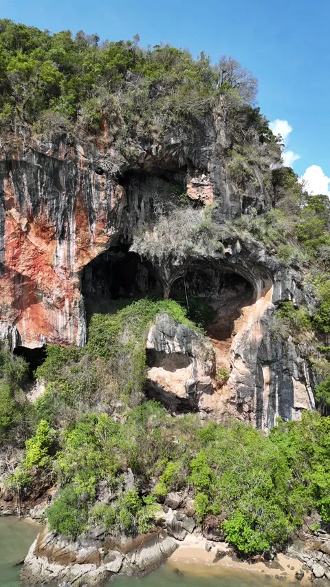 Drone Flying Away from Tropical Limestone Island Cave in Koh Lanta, Thailand Stock Footage 335959309