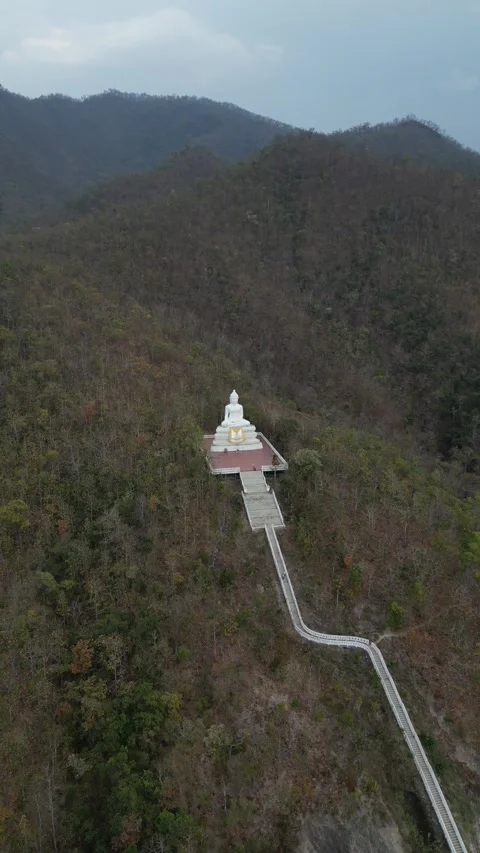 Drone Flying Away from White Buddha Statue on Mountain in Pai, Mae Hong Son, Stock Footage 335571195