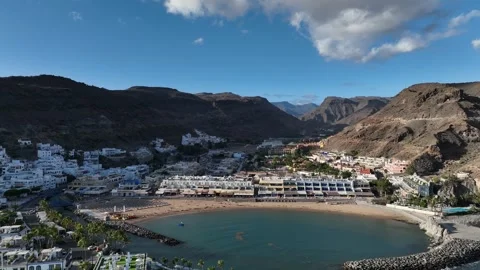 Drone Flying Back Revealing Beach and Puerto de Mogán – Gran Canaria Aerial Stock Footage 309951254