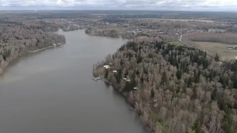 Drone flying backward and ascending over river Stock Footage 329742397