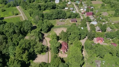 Drone flying backward and ascending over rural landscape Stock Footage 331829287