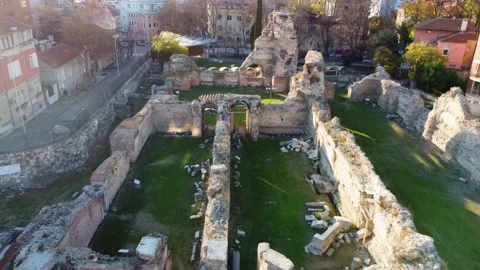 Drone flying backward and upward over old ruins of Roman Thermae in Europe Stock Footage 226292859