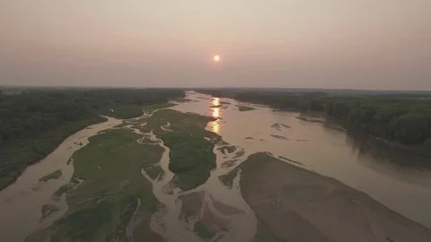 Drone Flying Backward Fast Over River To Field Raw Stock Footage 78886265