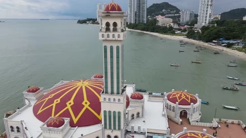 Drone flying Backward from floating mosque in Tanjung Bungah Stock Footage 150198766