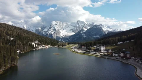 Drone flying backward over Misurina lake 스톡 동영상 155176191