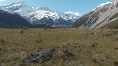Drone Flying Backward Over Mountain Meadow Stock Footage 145720036