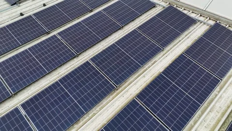 Drone Flying Backward Over Solar Panels On Corrugated Metal Industrial Roof Stock Footage 330750405