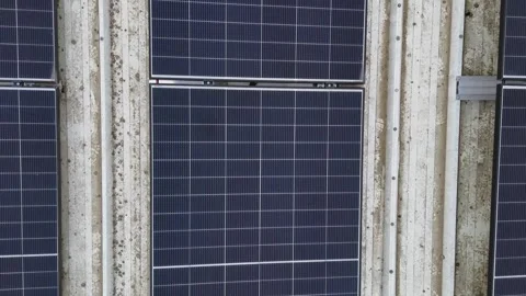 Drone Flying Backward Over Solar Panels On Corrugated Metal Industrial Roof Stock Footage 330750427