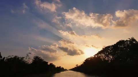 Drone Flying Backward Over Straight Canal During Golden Sunset Stock Footage 343606669