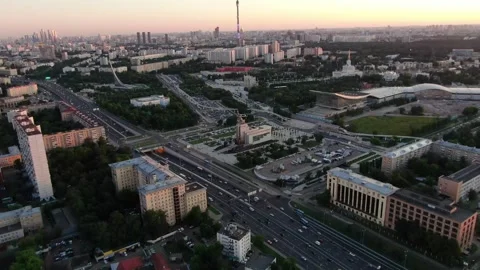 Drone flying backward over VDNKh and highways Stock Footage 321430294