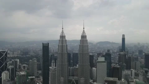 Drone flying backward from Petronas Twin Tower in Kuala Lumpur Stock Footage 150289366