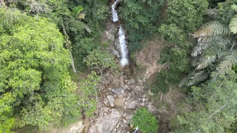 Drone flying backward from Pool and Waterfall in Jeram Toi Jelebu Stock Footage 149717911