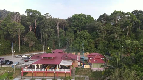 Drone flying backward from restaurant and food court in Pasir Panjang beach Stock Footage 150721384