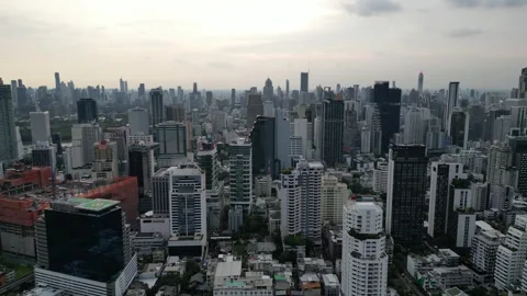 Drone Flying Backward from Skyscraper Helipad Over Bangkok, Thailand Cityscape Stock-Footage 333598305