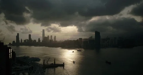 Drone flying backward, sunset clouds. Hong Kong skyline. Stock Footage 101860292