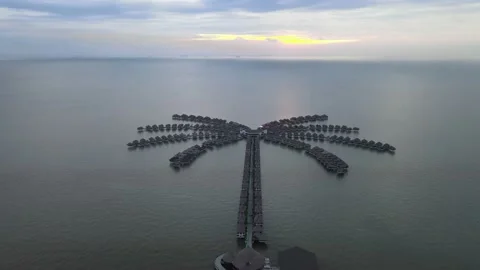 Drone flying backward from Unique Hotel in Sepang Selangor Stock Footage 149623699