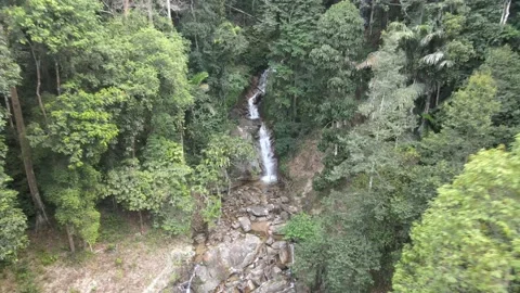 Drone flying backward from waterfall in Jelebu Negeri Sembilan Stock Footage 149717684