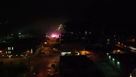 Drone flying backwards and exposing eerie sites of a city in chaos and unrest Stock Footage 134506033
