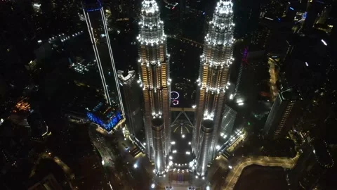 Drone flying backwards from The Highest Twin Tower in the World (Night view) Stock Footage 150290214