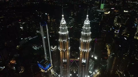 Drone flying backwards from The Highest Twin Tower in the World (Night view) Stock Footage 150290286