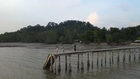 Drone flying backwards from jetty in Teluk Kemang Stock Footage 150721243