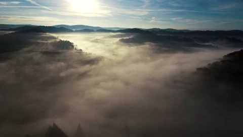 Drone flying backwards to the medieval church from Biertan village. Stock Footage