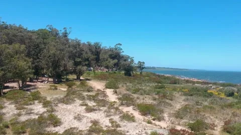 Drone flying backwards from the ocean Stock Footage 143229905