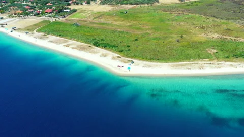 Drone flying backwards over beach Ksirotrypes Greece 2 Video stock 156799218