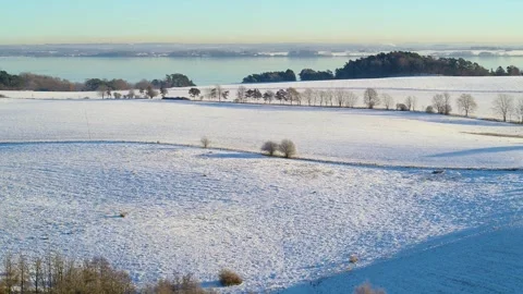 Drone flying backwards over beautiful winter landscape Stock Footage 305563656