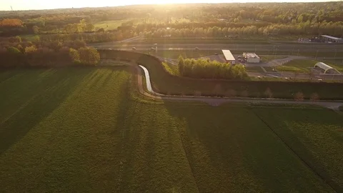 Drone flying backwards over dutch farm with ditches Video stock 75354053