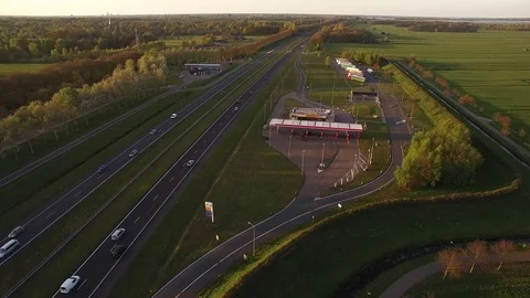 Drone flying backwards over dutch highway 4K Stock Footage 75354124