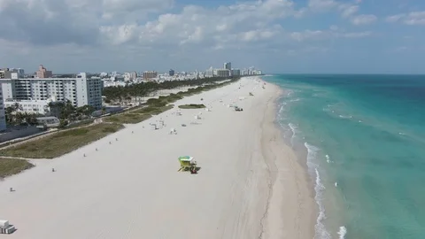 Drone Flying Backwards Over Empty South Beach During Covid 19 Lockdown Stock Footage 127063078