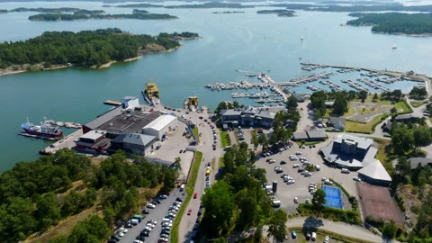 Drone flying backwards over the ferry queue at the Kasnas marina, Finland Video stock 320924315