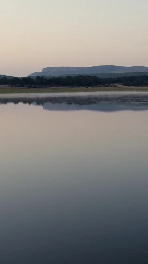 Drone flying backwards over La Cuerda del Pozo Reservoir in Soria 動画素材 342607600