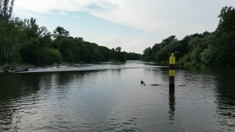Drone Flying Backwards Over River in Halle (Saale), Germany Revealing Waterfall Stock-Footage 331339031