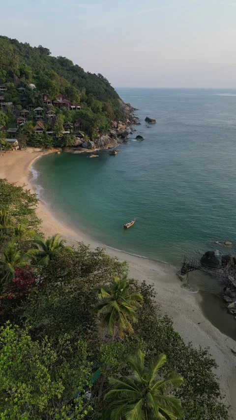 Drone Flying Backwards Over Tropical Beach and Coastline in Koh Phangan, Video stock 335814142