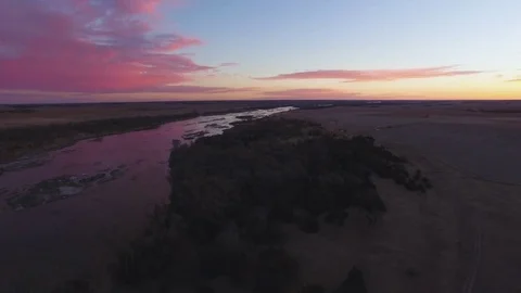 Drone Flying Backwards From River Stock Footage 78873202